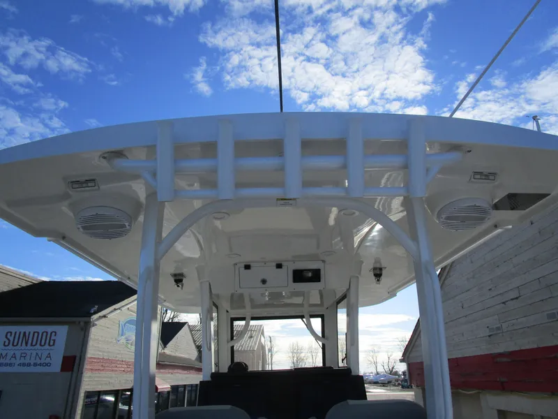 Slide: The Image of 2024 Sea Pro 322 Offshore boat with T-top and blue sky background. - 44