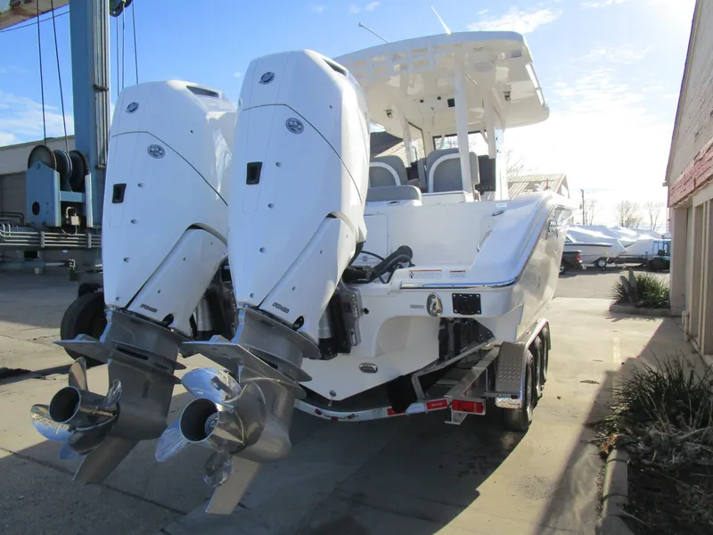 Slide: The Image of 2024 Sea Pro 322 Offshore boat with dual outboard engines. - 5