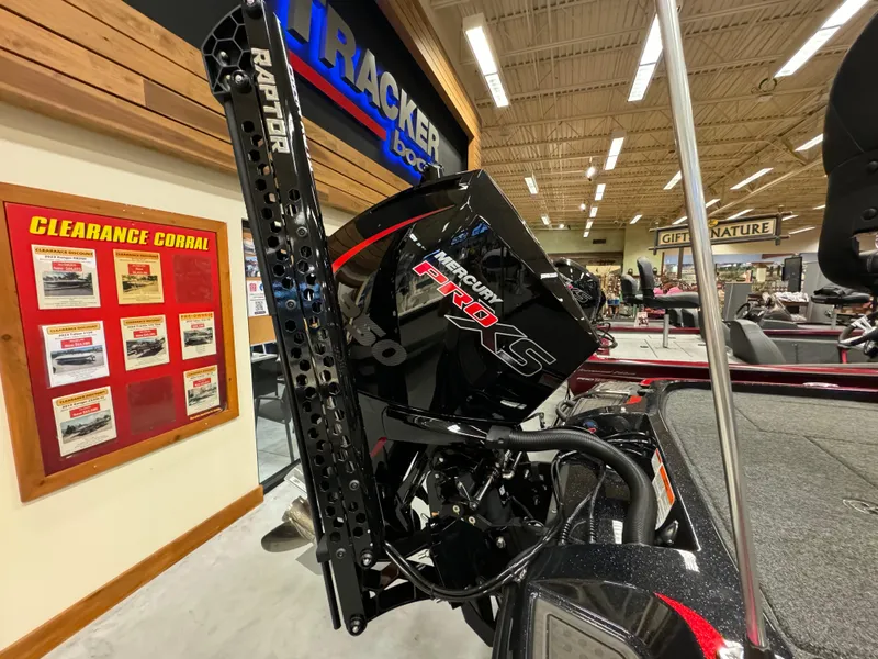 Slide: The Image of 2024 Nitro Z21 XL boat engine display in showroom with Raptor branding. - 4