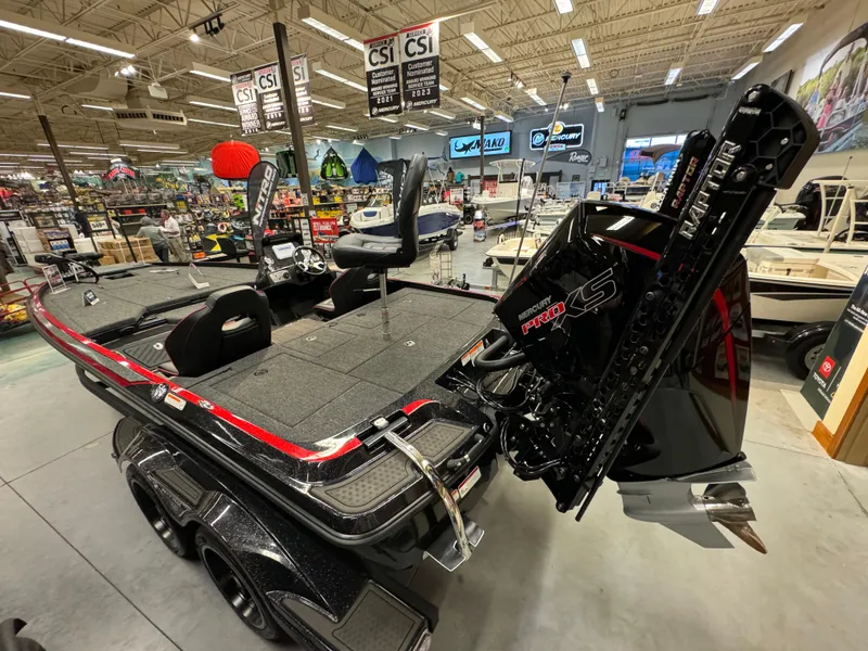 Slide: The Image of 2024 Nitro Z21 XL bass boat displayed in a showroom. - 7