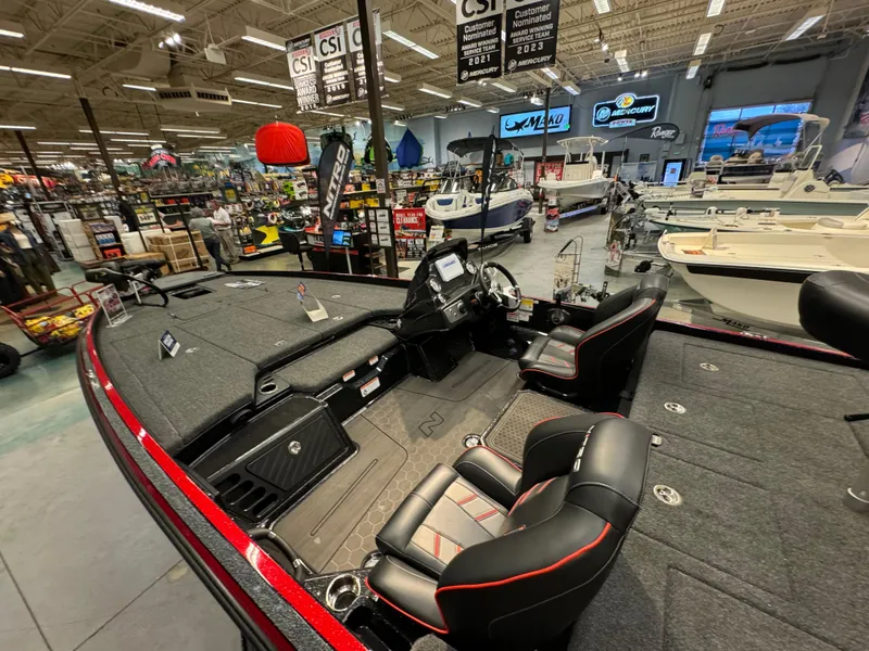 Slide: The Image of 2024 Nitro Z21 XL boat interior at a showroom, featuring sleek seating and modern design. - 8
