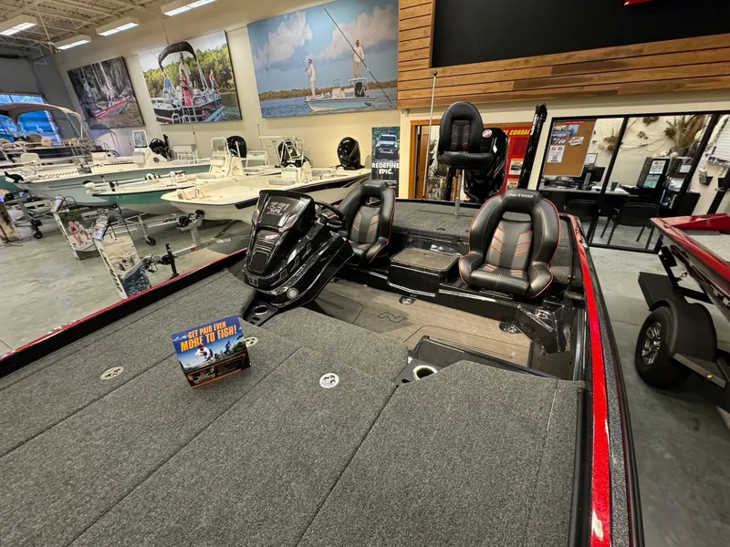 Slide: The Image of 2024 Nitro Z21 XL boat interior in showroom, featuring sleek seating and modern design. - 9