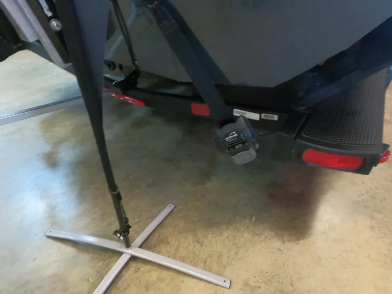 Slide: The Image of 2024 Ranger RT198P boat trailer with support stand and rear view. - 13
