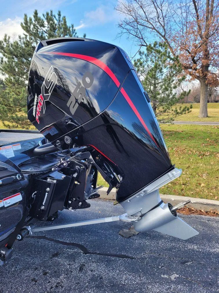 Slide: The Image of 2024 Nitro Z20 Pro outboard motor in a park setting. - 2