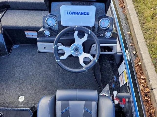 Slide: The Image of 2024 Nitro Z20 Pro boat dashboard with Lowrance electronics and modern steering wheel. - 3