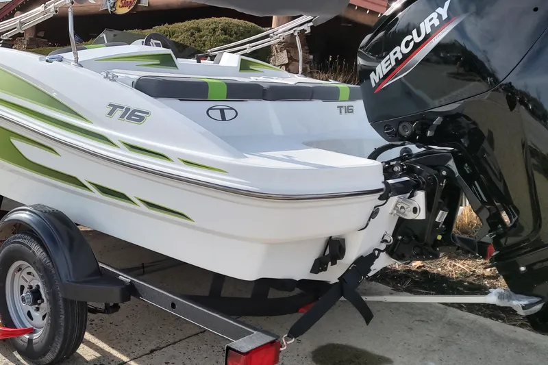 Slide: The Image of 2024 Tahoe T16 boat with Mercury engine on a trailer. - 3