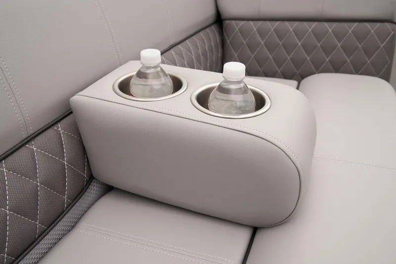 Slide: The Image of 2024 Ranger Reata 223C boat interior with cup holders and water bottles. - 30