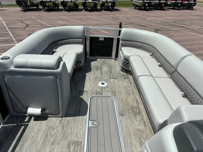 Slide: The Image of 2024 Ranger Reata 223C pontoon boat interior with spacious seating and modern design. - 9