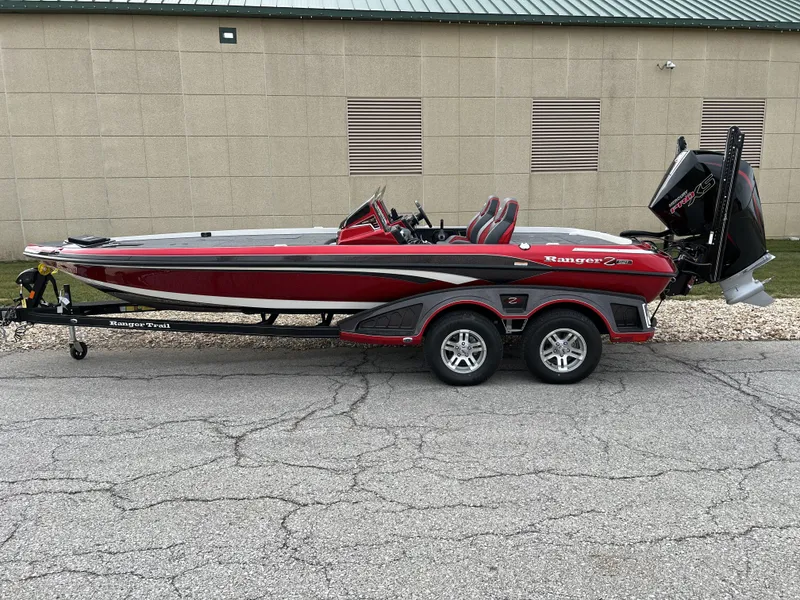 Slide: The Image of 2024 Ranger Z521R boat on trailer, red and black, side view. - 0