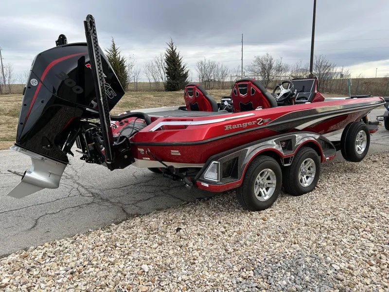 Slide: The Image of 2024 Ranger Z521R boat with dual-axle trailer, red and black color scheme. - 5