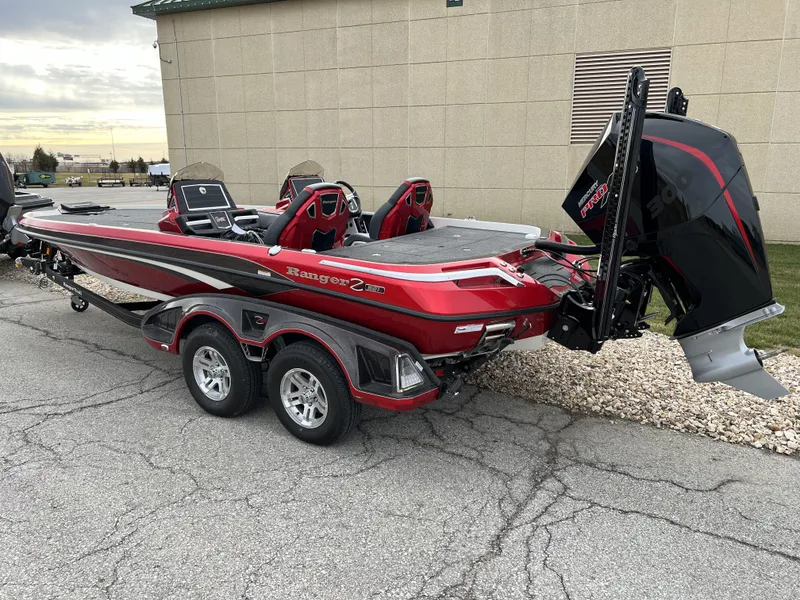 Slide: The Image of 2024 Ranger Z521R boat with dual-axle trailer, red and black color scheme. - 7
