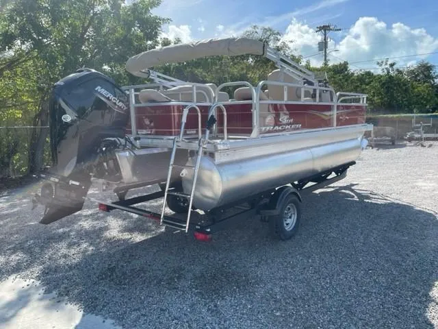 Slide: The Image of 2024 Sun Tracker Bass Buggy 18 DLX pontoon boat with Mercury outboard engine. - 8