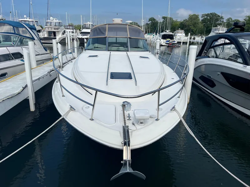 Slide: The Image of 1999 Sea Ray 380 Sundancer docked at a marina. - 2