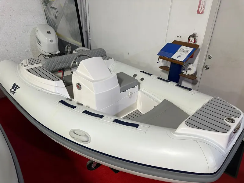 The Image of 2024 Tiger Marine PT 370 inflatable boat on display indoors. - 1