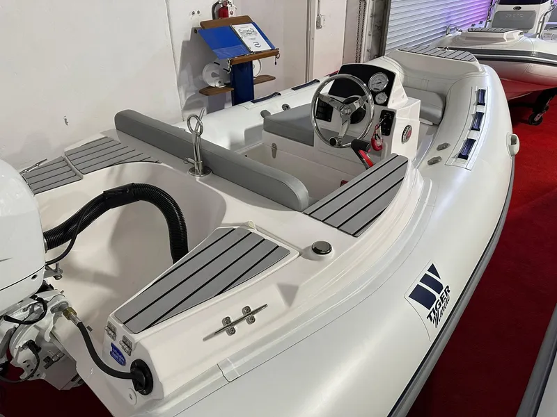Slide: The Image of 2024 Tiger Marine PT 370 inflatable boat with steering console and seating. - 3