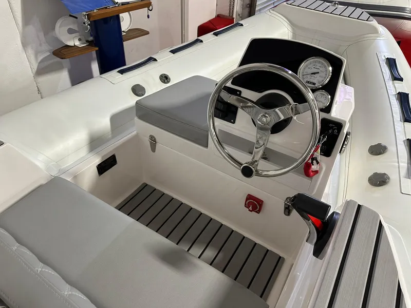 Slide: The Image of 2024 Tiger Marine PT 370 boat interior with steering wheel and control panel. - 4