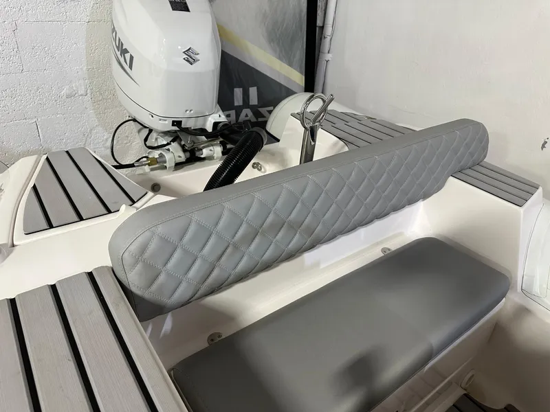 Slide: The Image of 2024 Tiger Marine PT 370 boat interior with Suzuki outboard motor. - 5