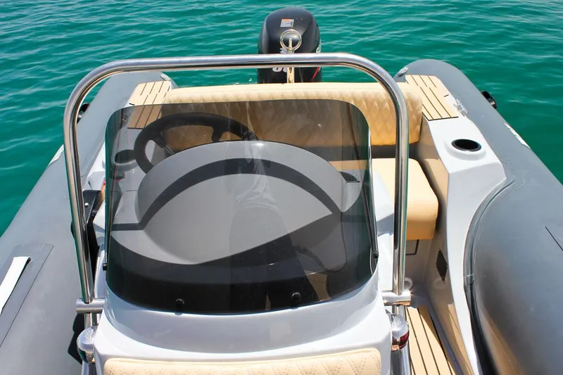 Slide: The Image of 2024 Tiger Marine SL 480 boat interior with steering wheel and seating. - 15
