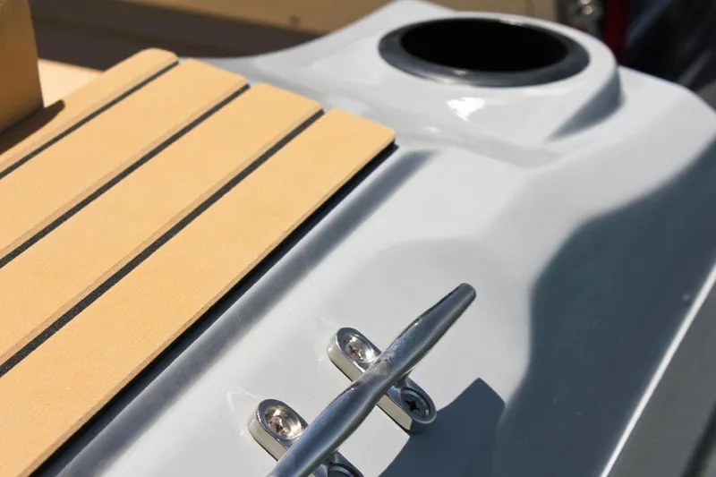 Slide: The Image of Close-up of 2024 Tiger Marine SL 480 boat deck with cleat and cup holder. - 19