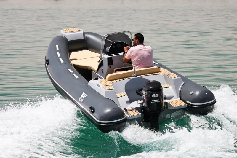 Slide: The Image of 2024 Tiger Marine SL 480 inflatable boat cruising on water. - 20