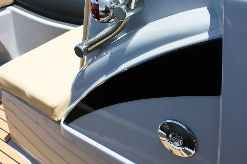 Slide: The Image of Close-up of 2024 Tiger Marine SL 480 boat's control panel and seating. - 9