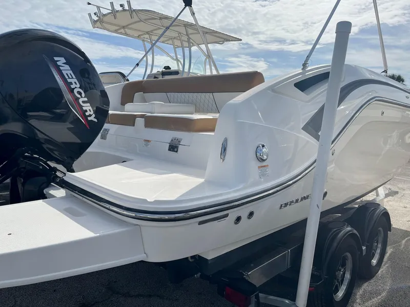 Slide: The Image of 2021 Bayliner DX 2200 boat on EZ Loader trailer. - 2