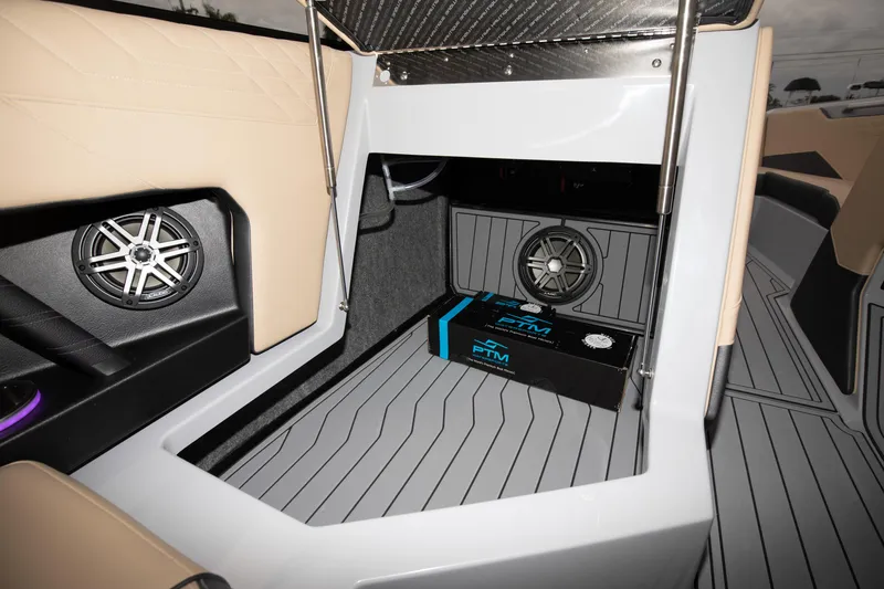 Slide: The Image of 2024 Nautique Super Air Nautique S23 interior with premium sound system. - 11