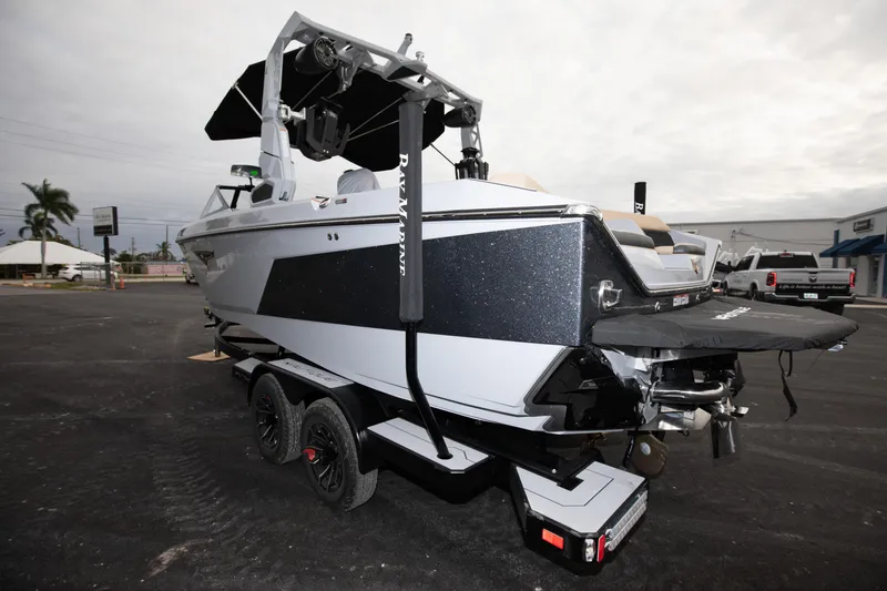 Slide: The Image of 2024 Nautique Super Air Nautique S23 boat on trailer, rear view. - 17