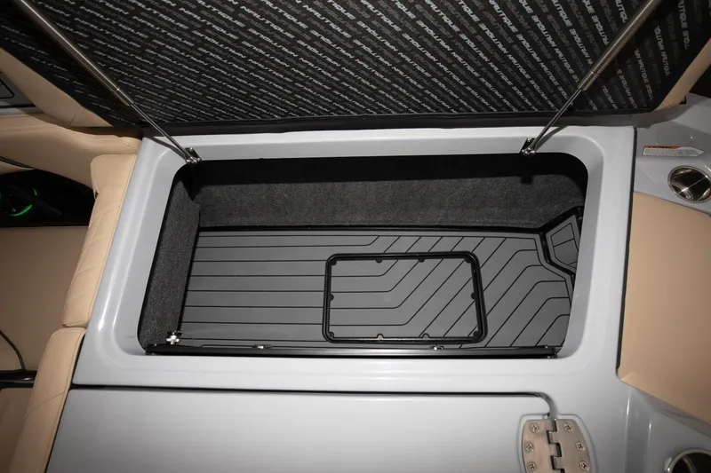 Slide: The Image of 2024 Nautique Super Air Nautique S23 storage compartment with open lid - 21
