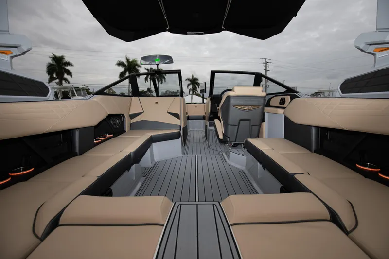 Slide: The Image of 2024 Nautique Super Air Nautique S23 interior, luxury seating, modern design, spacious layout. - 9