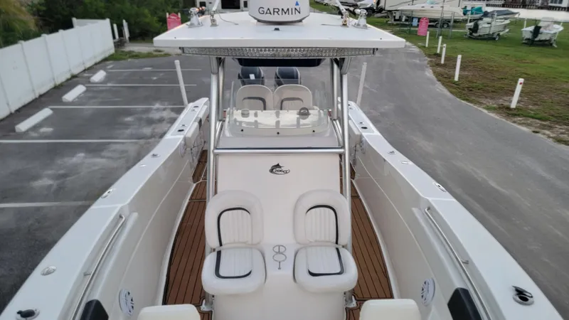 Slide: The Image of 2010 Sea Fox 286 Commander boat with Garmin equipment, docked in a parking area. - 5