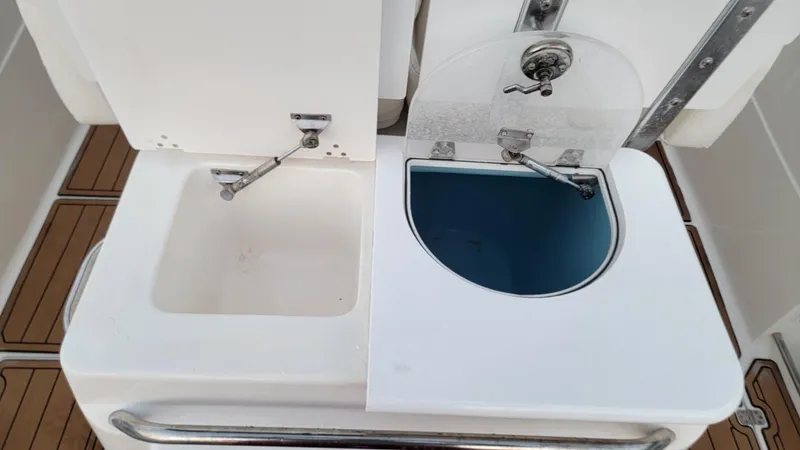 Slide: The Image of Livewell and storage compartments on a 2010 Sea Fox 286 Commander boat. - 7