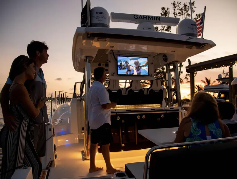 Slide: The Image of People enjoying evening on 2021 Jeanneau Leader 12.5 boat with outdoor TV. - 10