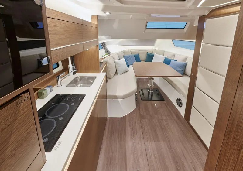 Slide: The Image of Modern interior of 2021 Jeanneau Leader 12.5 yacht with kitchen and seating area. - 11