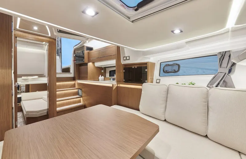 Slide: The Image of Interior of 2021 Jeanneau Leader 12.5 yacht with modern design and comfortable seating. - 14