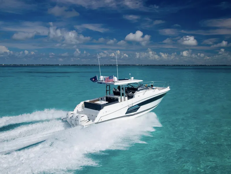Slide: The Image of 2021 Jeanneau Leader 12.5 cruising on clear turquoise waters. - 15