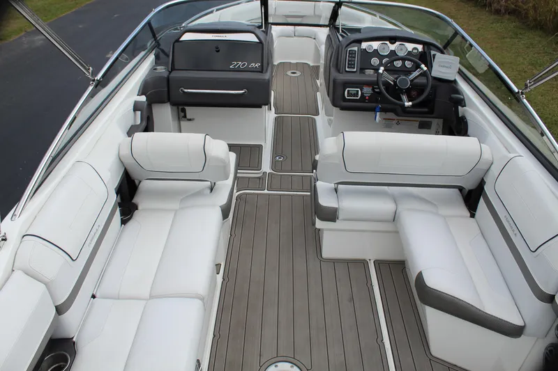 Slide: The Image of 2016 Formula 270 Bowrider interior with white seating and modern dashboard. - 21