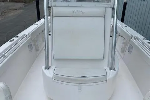 Slide: The Image of 2015 Contender 24 Sport boat interior with white seating and console. - 4