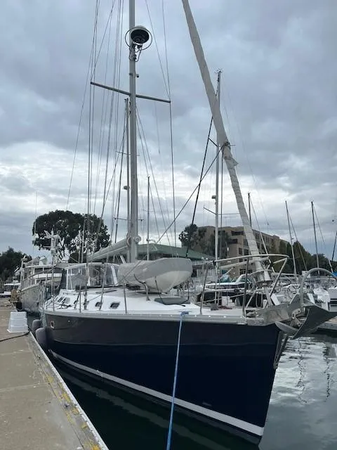 Slide: The Image of Sailboat docked at marina, Catalina 470, 2009 model, under cloudy skies. - 2