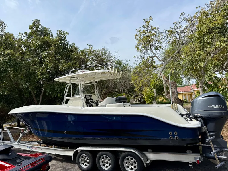 Slide: The Image of 2008 Hydra-Sports Vector 2900 CC boat on trailer, surrounded by trees. - 1