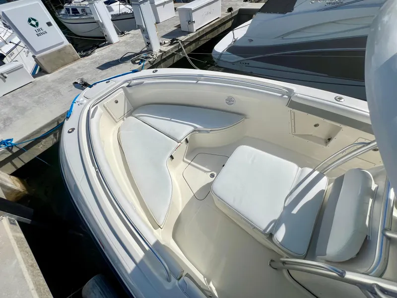 Slide: The Image of 2008 Hydra-Sports Vector 2900 CC boat with white seating, docked at a marina. - 11