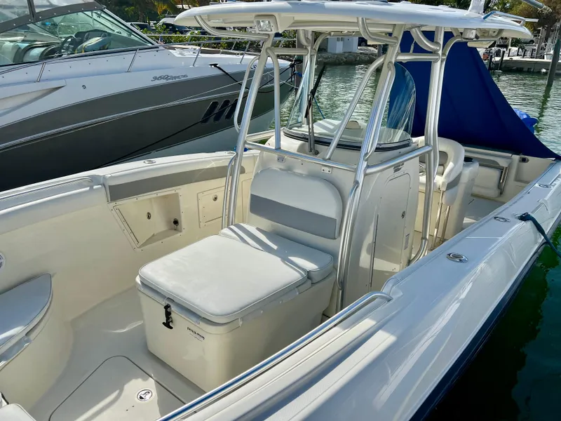 Slide: The Image of 2008 Hydra-Sports Vector 2900 CC boat with seating and console, docked by the water. - 12