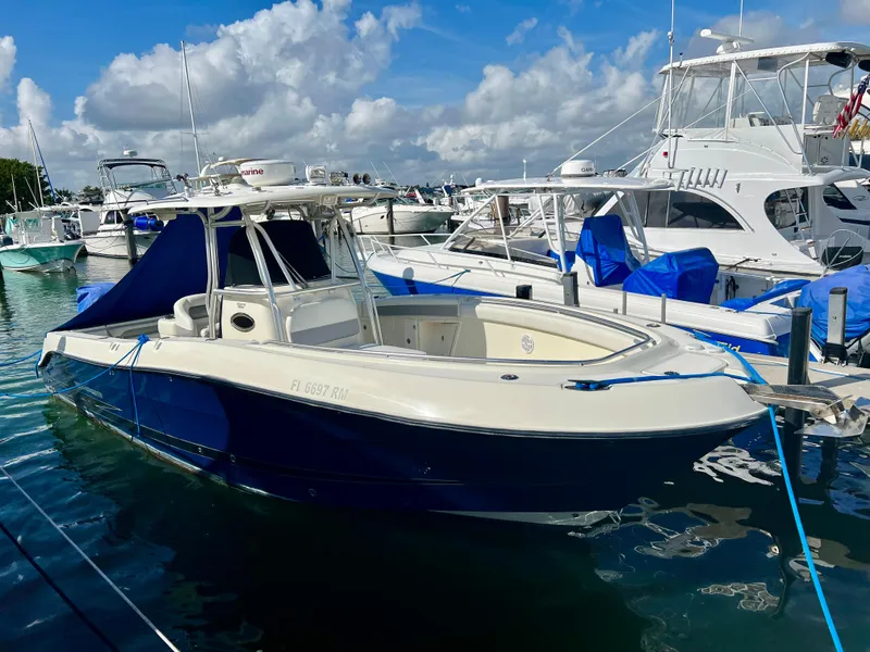 Slide: The Image of 2008 Hydra-Sports Vector 2900 CC boat docked in a marina under a partly cloudy sky. - 13