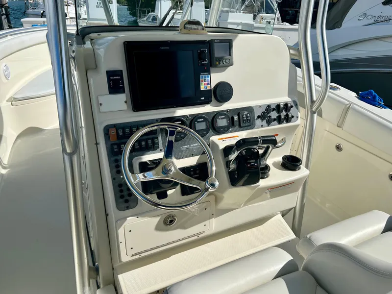 Slide: The Image of 2008 Hydra-Sports Vector 2900 CC helm with steering wheel and navigation controls. - 14