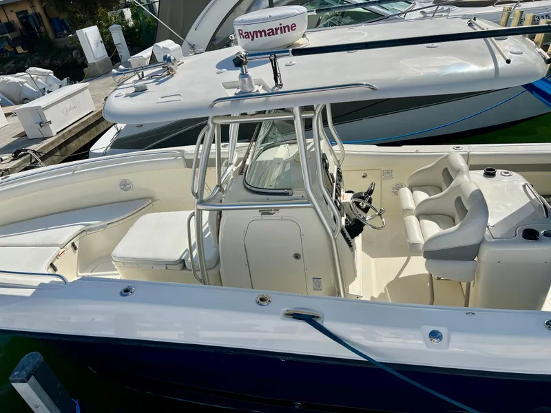Slide: The Image of 2008 Hydra-Sports Vector 2900 CC boat with Raymarine equipment, docked at a marina. - 15