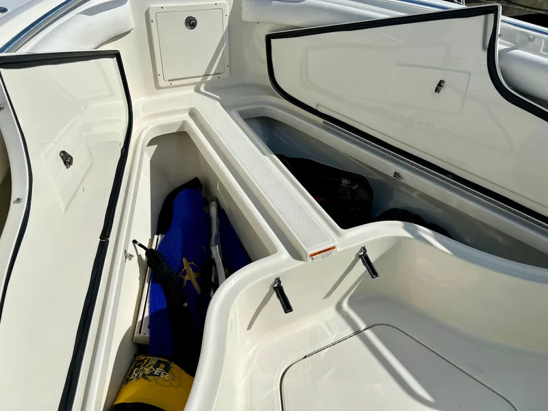 Slide: The Image of 2008 Hydra-Sports Vector 2900 CC boat storage compartments with gear inside. - 17