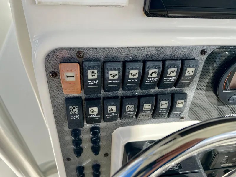 Slide: The Image of Control panel of 2008 Hydra-Sports Vector 2900 CC boat with labeled switches. - 19