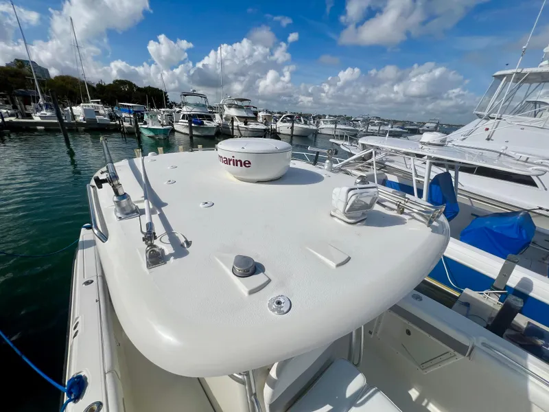Slide: The Image of 2008 Hydra-Sports Vector 2900 CC boat docked at a marina under a partly cloudy sky. - 22