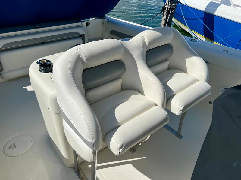 Slide: The Image of 2008 Hydra-Sports Vector 2900 CC boat seats, white leather, dual design, docked by water. - 23