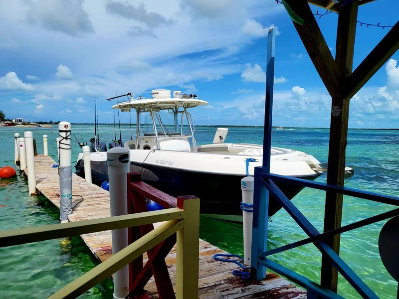 Slide: The Image of 2008 Hydra-Sports Vector 2900 CC docked by turquoise waters under a clear blue sky. - 34